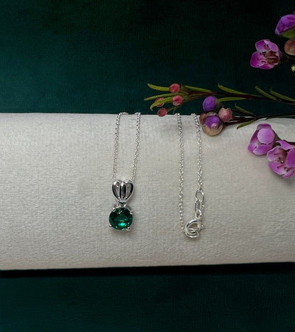 Emerald Solitaire Pendant Necklace: Rhodium Plated Sterling Silver