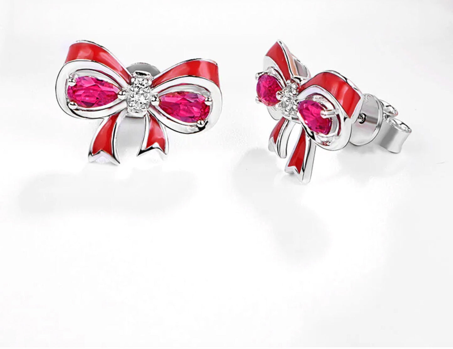 Sterling Silver Ruby Bow Earrings: Pear Cut Gemstone Studs