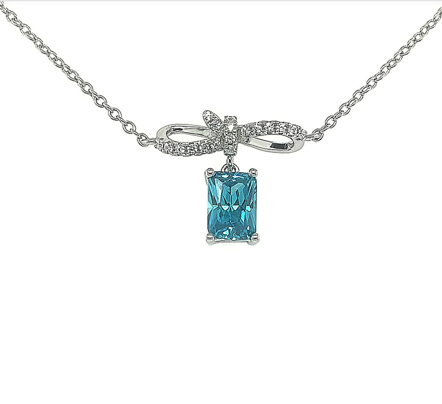 Sterling Silver Bow Pendant Necklace: Blue Cubic Zirconia, Adjustable Chain