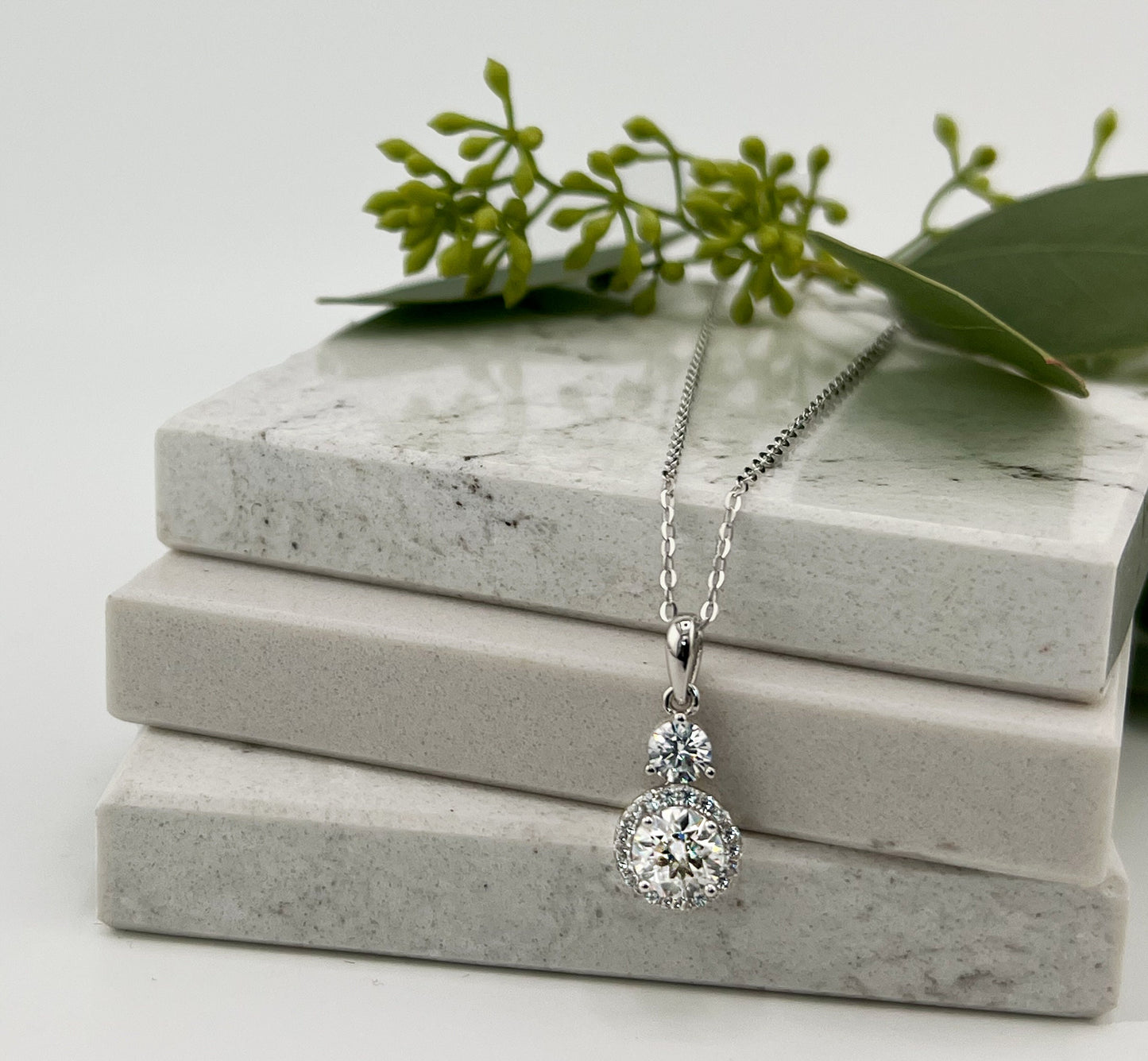 1.5CTW VVS1 Moissanite Halo Necklace: Rhodium Plated Sterling Silver Pendant