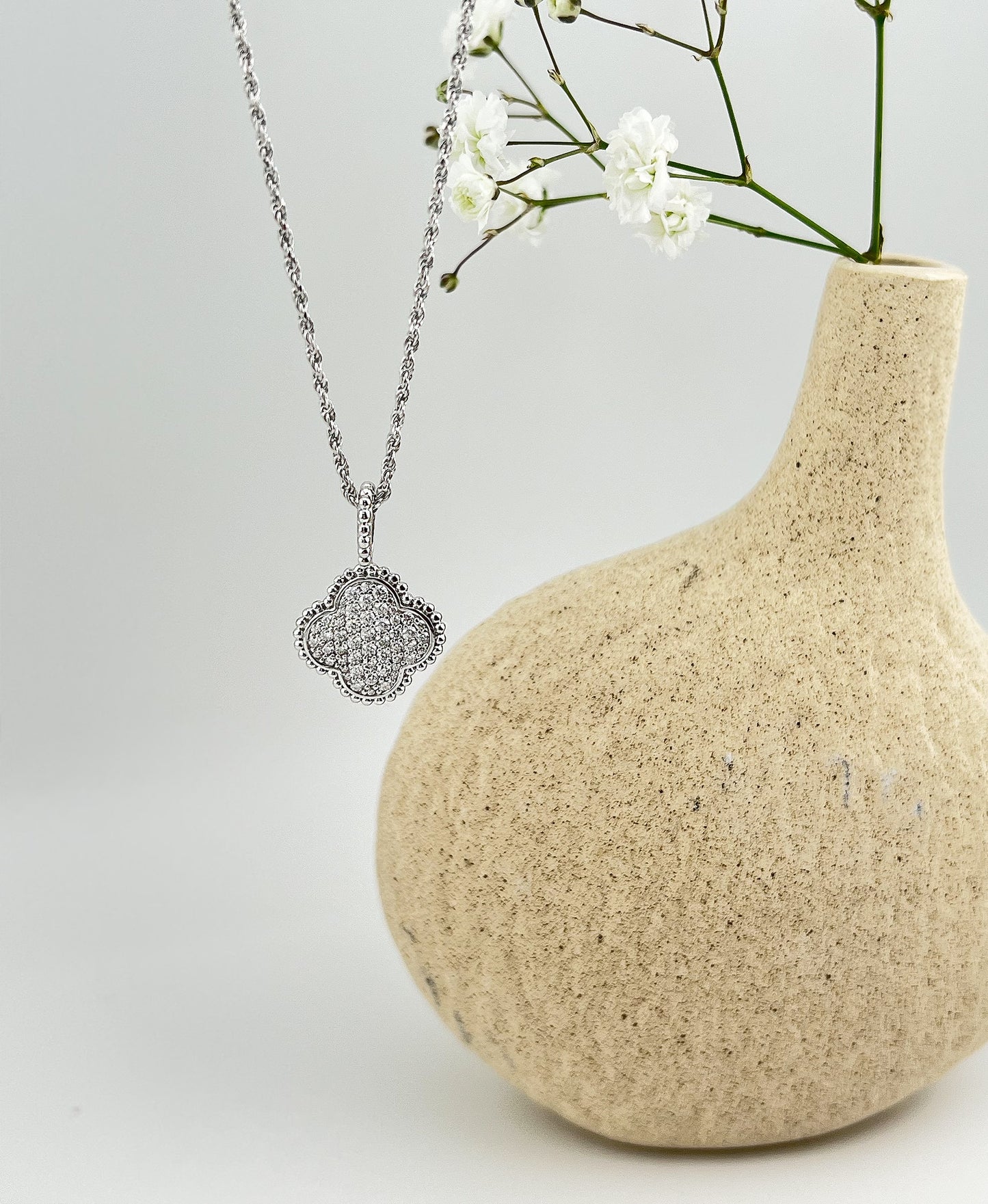 Moissanite Four-Leaf Clover Necklace: Rhodium Plated Sterling Silver Pendant