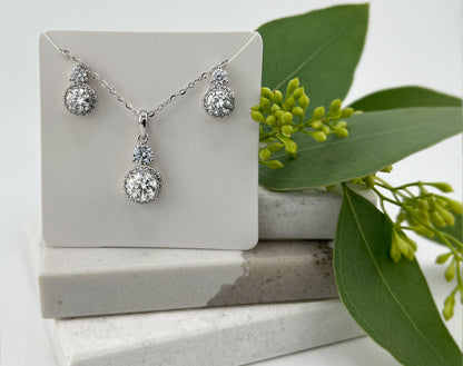 1.5CTW VVS1 Moissanite Halo Necklace: Rhodium Plated Sterling Silver Pendant