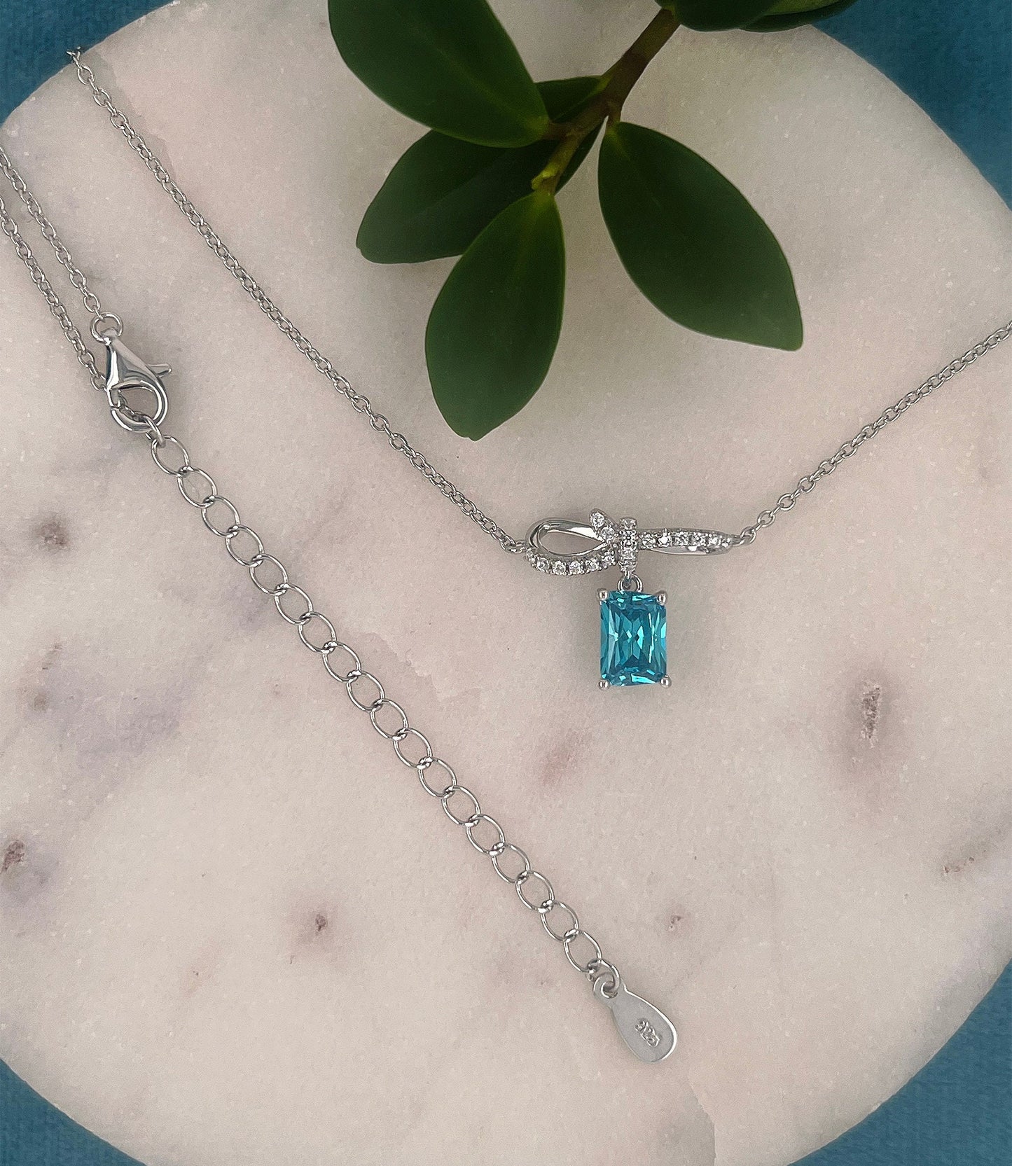 Sterling Silver Bow Pendant Necklace: Blue Cubic Zirconia, Adjustable Chain