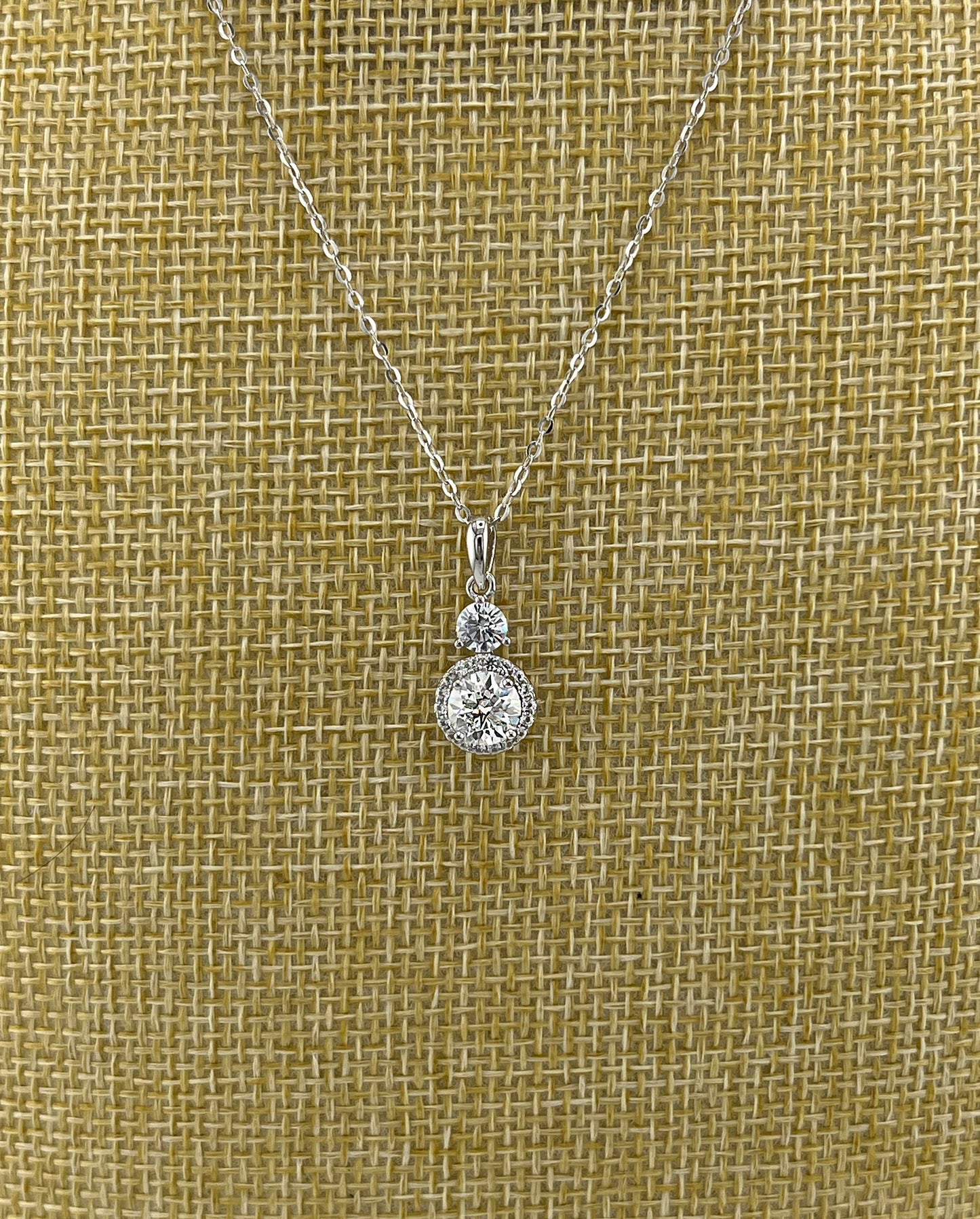1.5CTW VVS1 Moissanite Halo Necklace: Rhodium Plated Sterling Silver Pendant